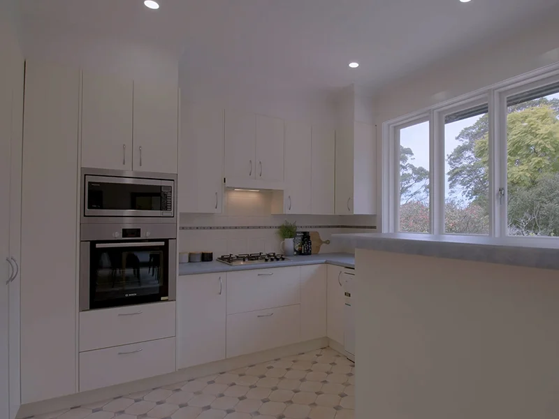 Built-in electric oven installed within white kitchen cabinetry at Stafford Road, Artarmon