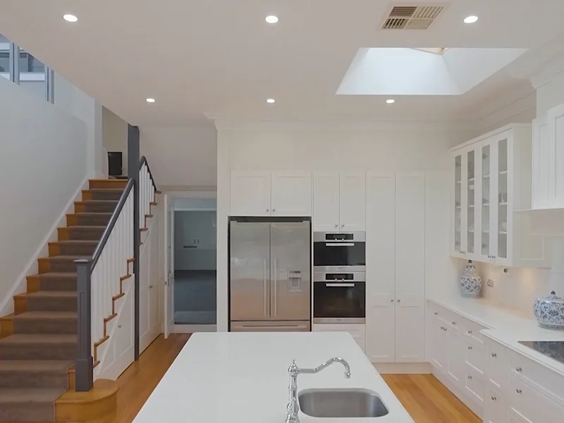 Built-in electric oven installation in modern white kitchen at Aston Street, Hunters Hill