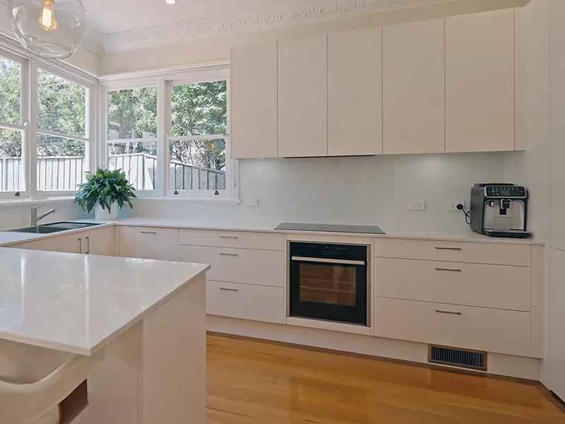Built-in electric oven installation in modern white kitchen at Nelson Street, Gordon