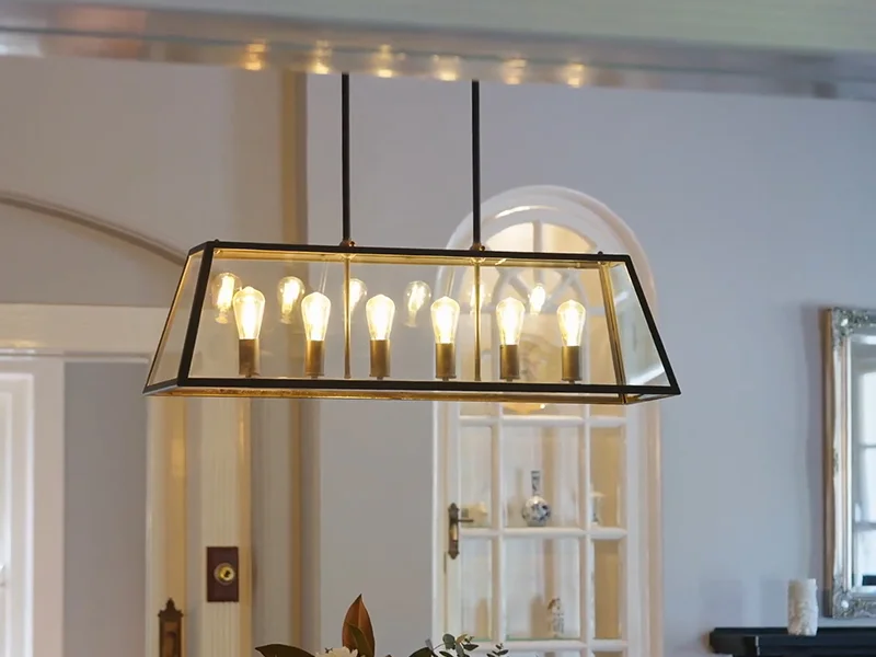 Glass box pendant light with exposed bulbs installed in dining area at Ada Avenue, Wahroonga