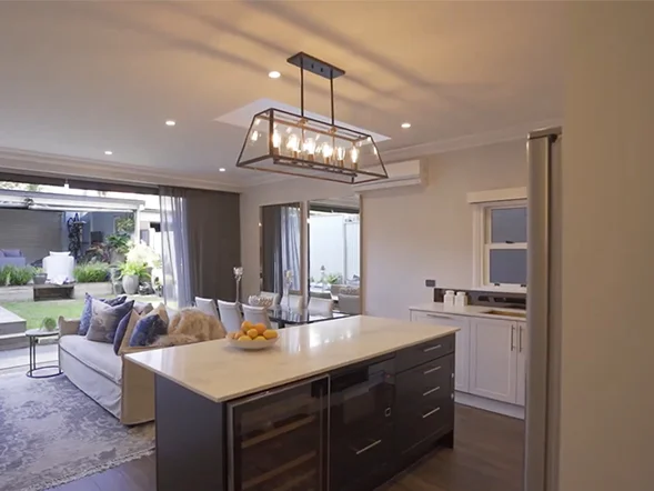 Rectangular glass pendant light installed above kitchen island providing ambient lighting at Salisbury Road, Stanmore