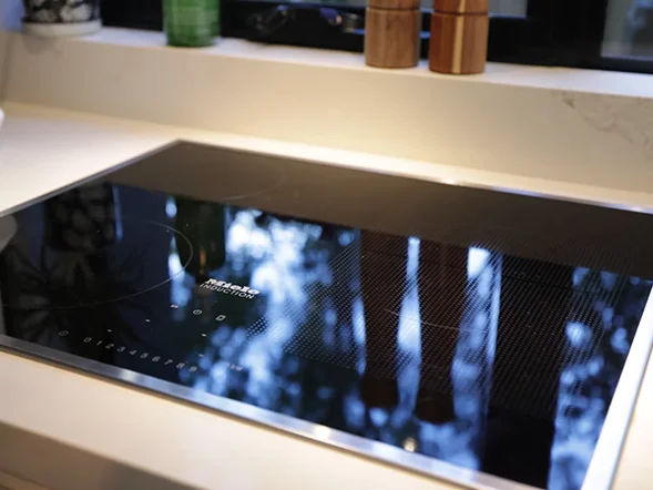 Built-in induction cooktop installation on stone benchtop at Georges Crescent, Drummoyne