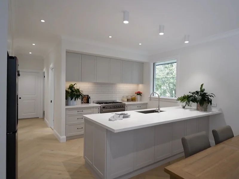 Modern ceiling downlights and pendant-style surface lights installed in kitchen at Margaret Street, Roseville