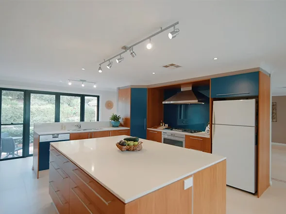 LED track lighting installation on ceiling providing adjustable illumination in kitchen at Adam Place, Glenhaven