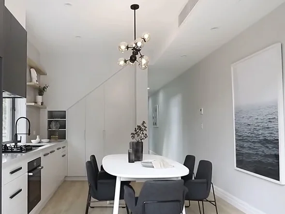 Modern multi-globe pendant light installed above dining table in open-plan kitchen at Chelmsford Street, Newtown