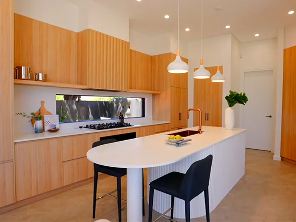 Pendant light installation above kitchen island at Keysor Road, Pagewood