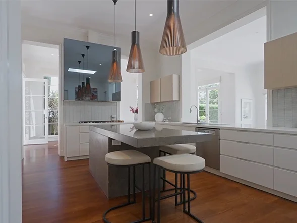 Pendant light installation above kitchen island at Dangar Street, Randwick