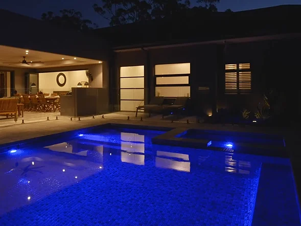LED pool lighting installed within swimming pool creating ambient night illumination at Carters Road, Dural