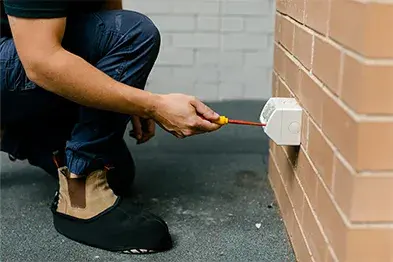 Calibre Connect electrician installing an outdoor power point
