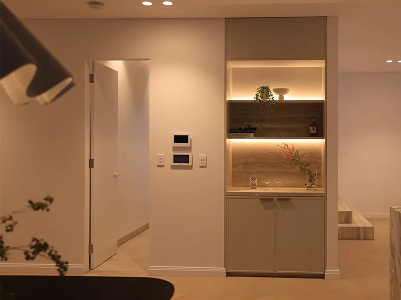 Smart home control panel installed on interior wall in modern home at Fitzroy Street, Burwood