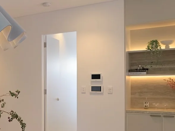 Smart home control panel and intercom system installed on wall for centralized home automation at Burwood in the Inner West