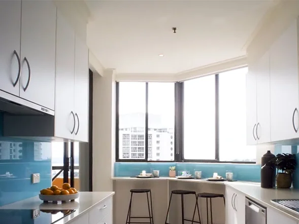 Smoke alarm detector installation on kitchen ceiling at Spring Street, Bondi Junction