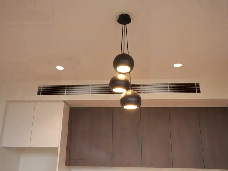 Three-light black pendant installation in modern interior at Goodwood Street, Kensington