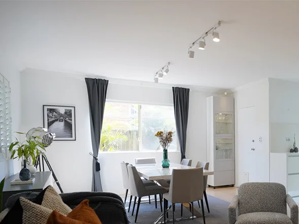 Ceiling mounted track lighting installation in living and dining area at Hanks St, Ashfield