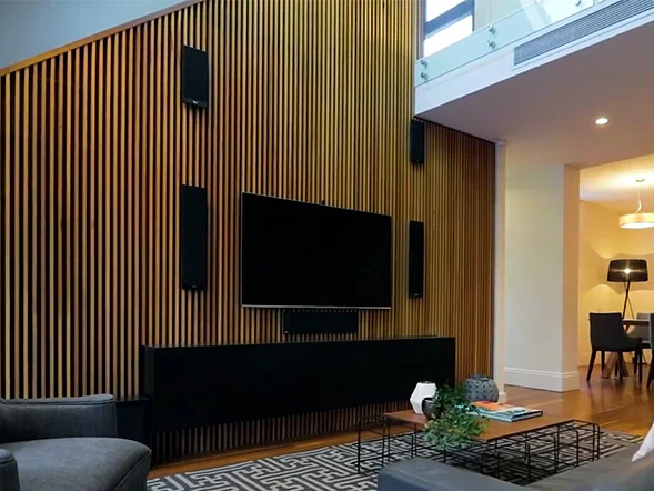 Wall-mounted television installation centered on feature timber panel wall at Alfred Street, Lilyfield
