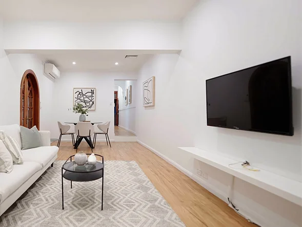 Modern wall-mounted TV installation in minimalist living room setup at Terry Street, Tempe