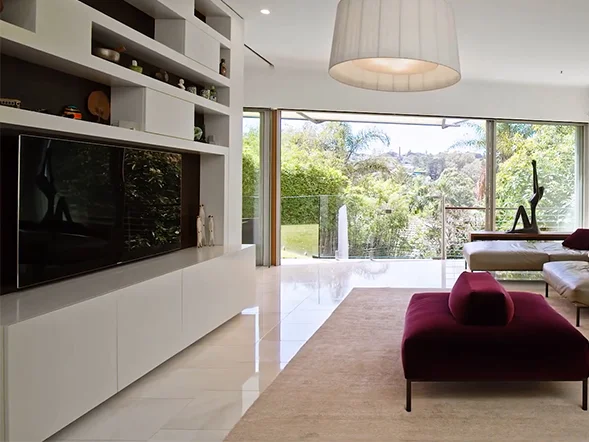 Wall mounted television installation in modern living room at Wallaroy Road, Woollahra