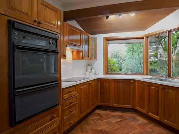 Built-in wall oven installation within timber kitchen cabinetry at Westwood Street, Pennant Hills