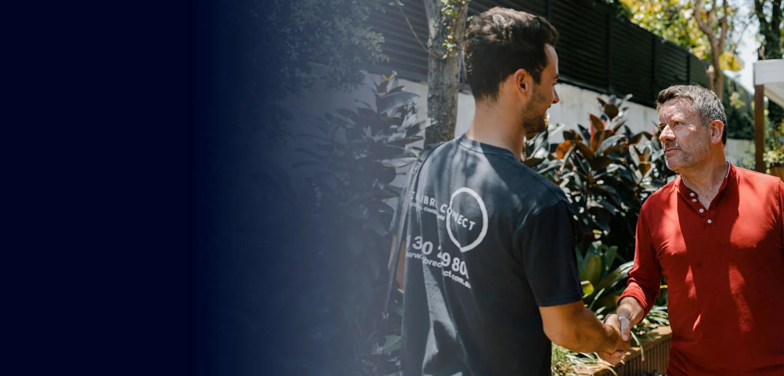 Calibre Connect electrician shaking hands with a homeowner in Sydney after completing an electrical service visit