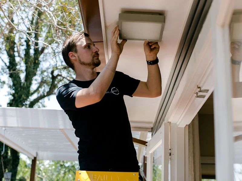 IP44 rated outdoor lighting being installed by Calibre Connect on a ceiling