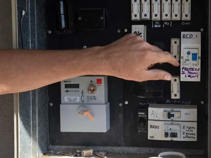 Calibre Connect electrician checking RCD safety switch protection on a home switchboard in Sydney