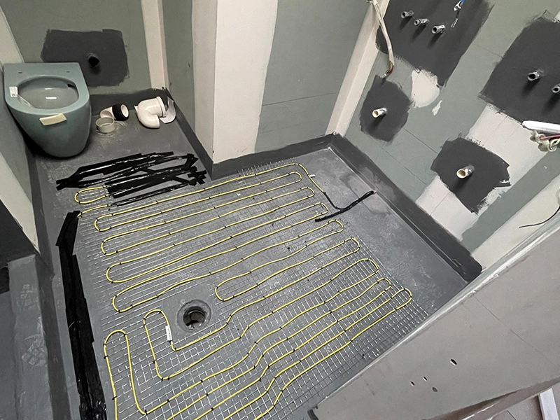 Electric underfloor heating cables installed beneath a bathroom floor in a Sydney home