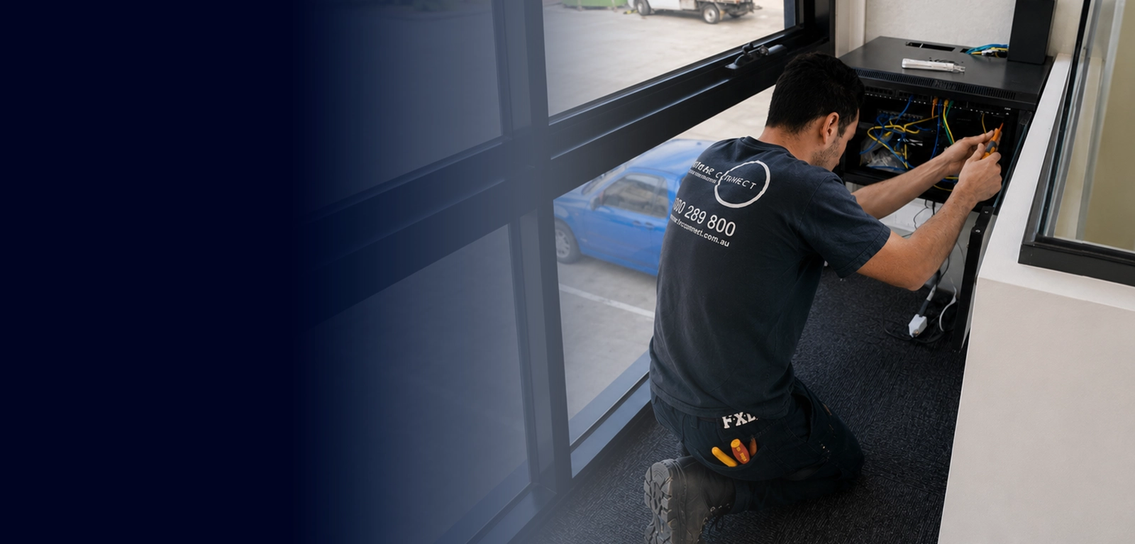 Calibre Connect technician installing data cabling in a Sydney commercial office