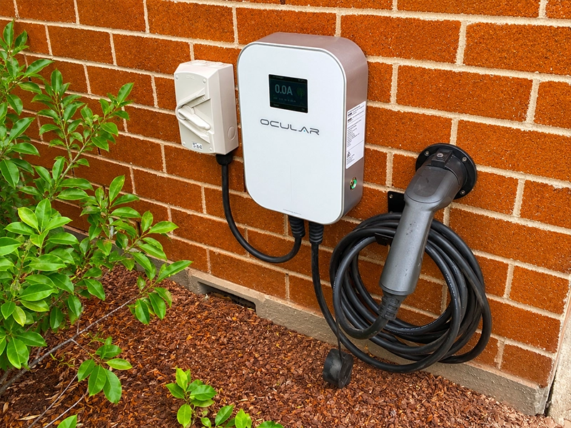Calibre Connect electrician installing and wiring an EV charger at a Sydney home