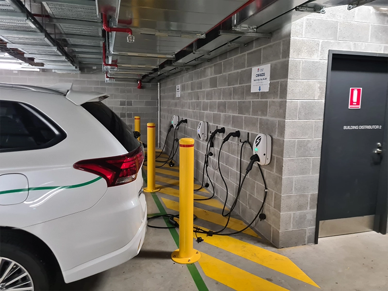 Multiple commercial EV chargers installed in a Sydney car park for shared vehicle charging
