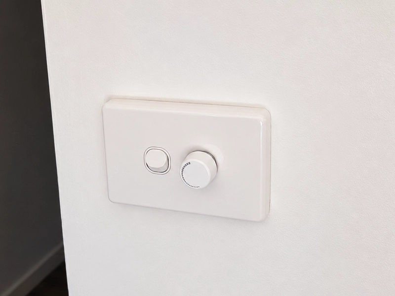 Wall dimmer switch for controlling LED downlight zones in a Sydney property