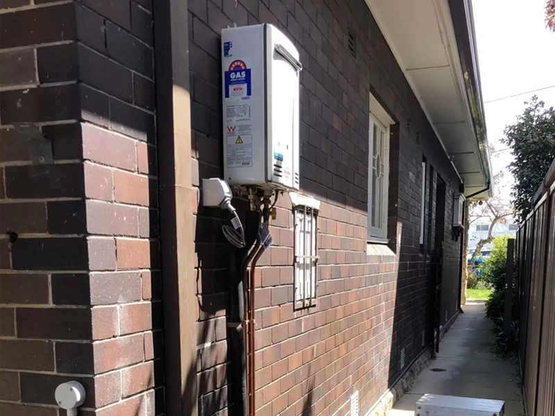 Exterior hot water system requiring suitable electrical load capacity in a Sydney home