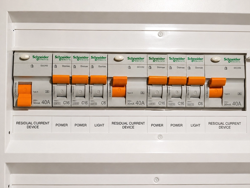 Modern switchboard with safety switches and circuit breakers for managing frequent tripping in a Sydney property