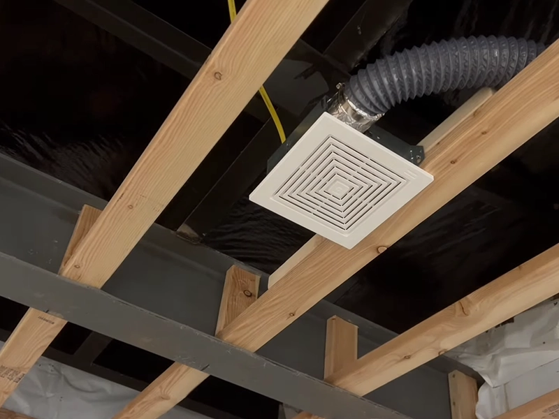 Inline exhaust fan with ducting installed in a Sydney ceiling cavity for moisture control