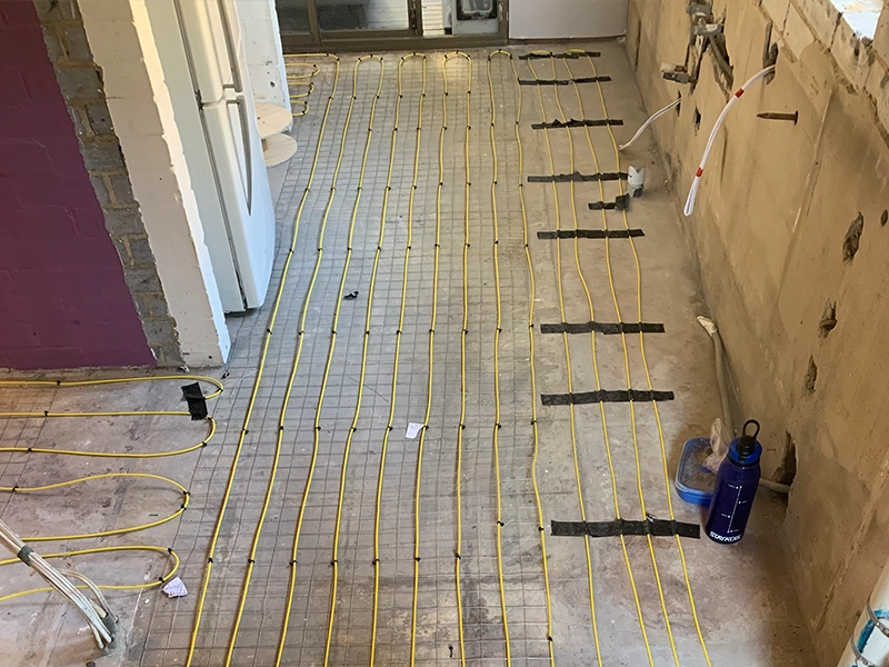 Electric underfloor heating cables installed beneath a kitchen floor in a Sydney home