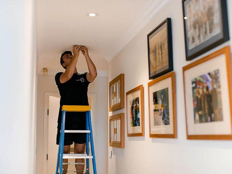 LED downlights installed in a hallway to improve stair and walkway lighting in a Sydney home
