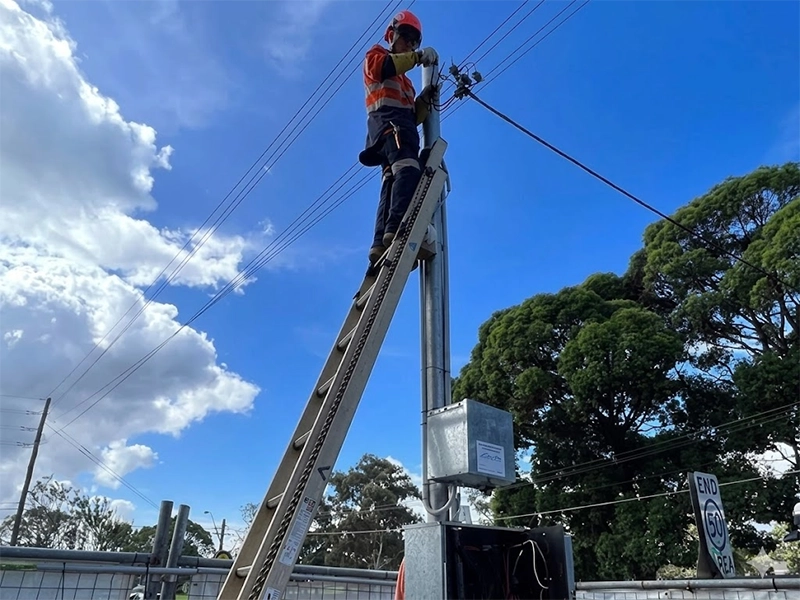 Level 2 electrician working on an overhead service connection in Sydney