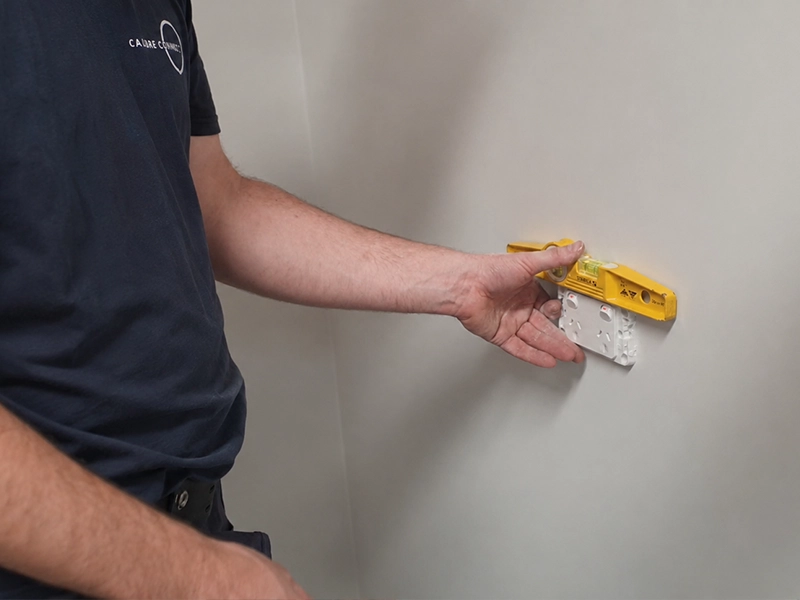 Electrician installing a new double GPO power point on an internal wall in a Sydney home