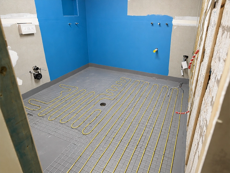 Electric underfloor heating cables installed during a bathroom renovation in a Sydney home