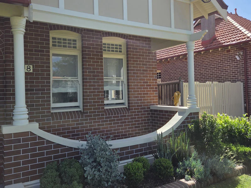 Fully restored heritage brickwork and retuckpointing after switchboard removal on the front porch in Haberfield.