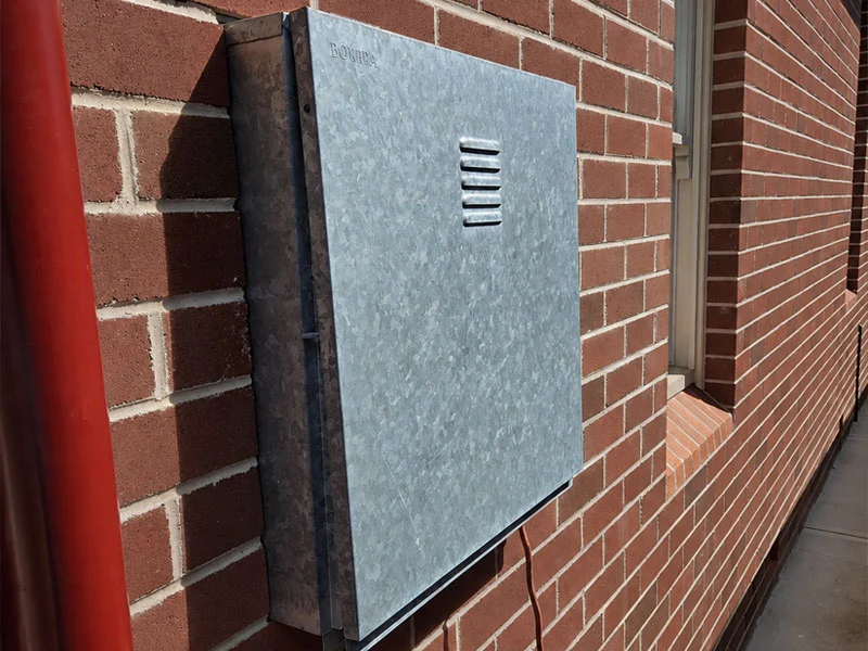 Side angle of the new weatherproof Bovara galvanised steel enclosure in Haberfield
