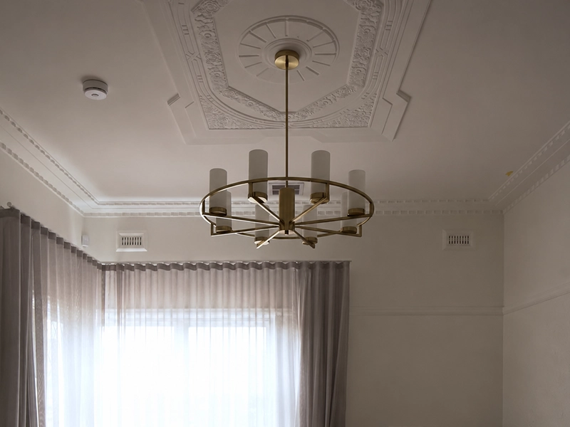 Smoke alarm installed on the ceiling of a Sydney Art Deco apartment