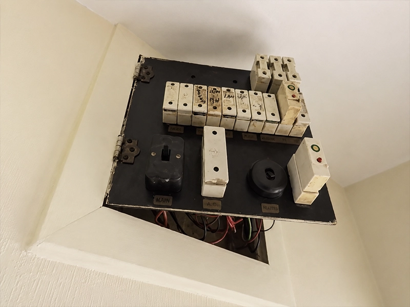Older switchboard without safety switches in a Sydney property