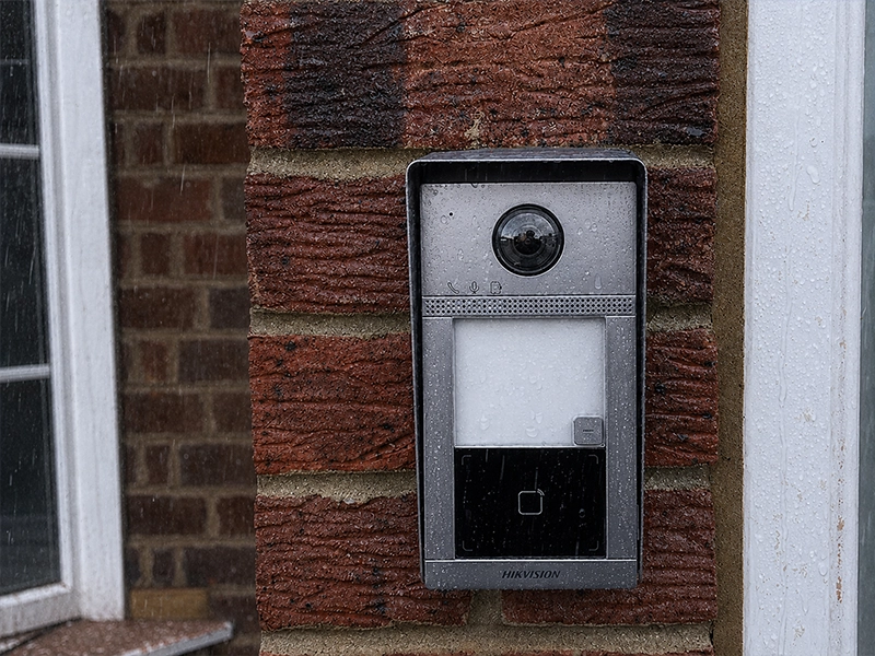 Weatherproof video intercom installed on an exterior brick wall for outdoor use in Sydney
