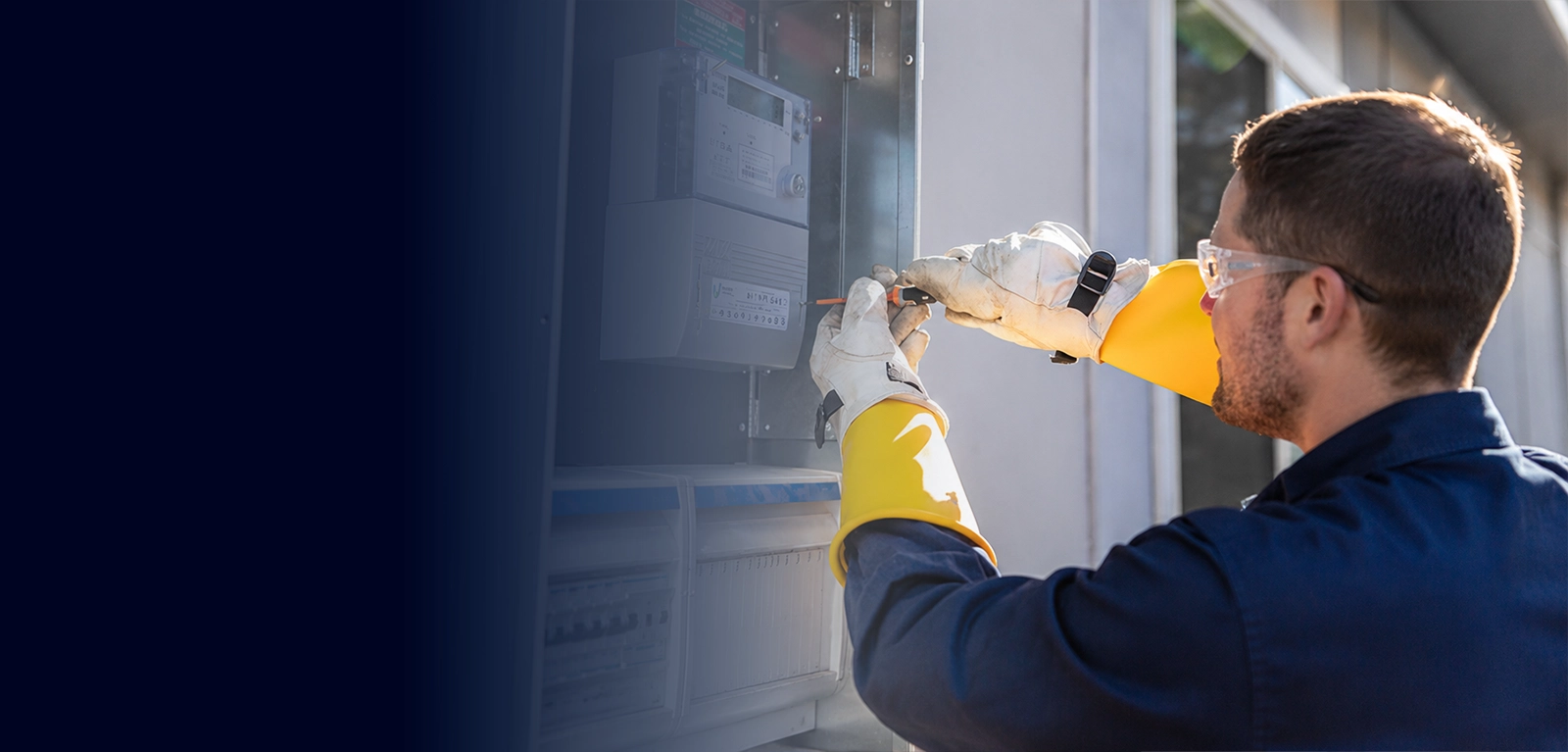 Electrician installing and servicing an electricity meter box for a property electrical supply